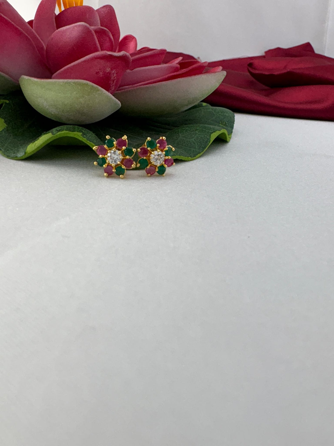 FeelOri tropical punch multi-color AD studs styled with lotus showcasing vibrant island paradise aesthetic