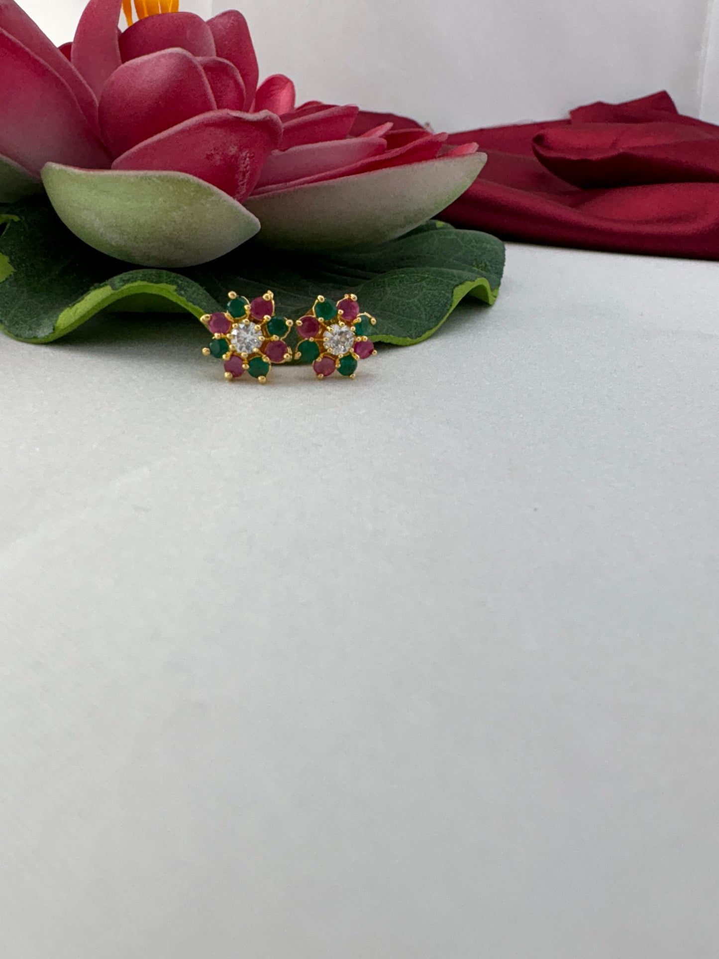 FeelOri tropical punch multi-color AD studs styled with lotus showcasing vibrant island paradise aesthetic