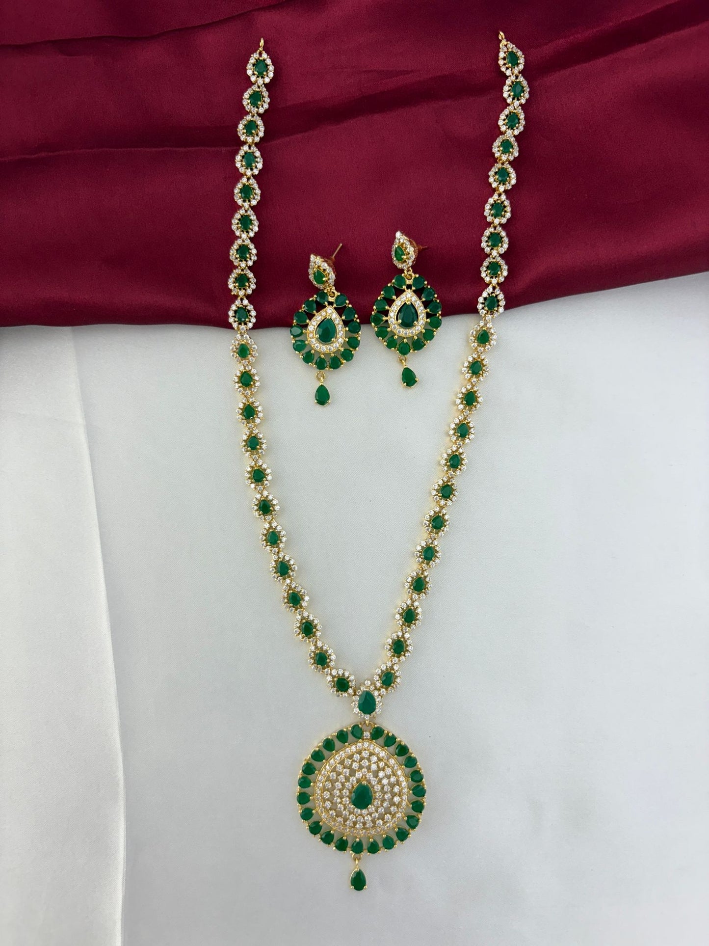 FeelOri Verdant Glade Emerald & AD Marquise Long Necklace and Earring Set - Full view on dual-tone background.