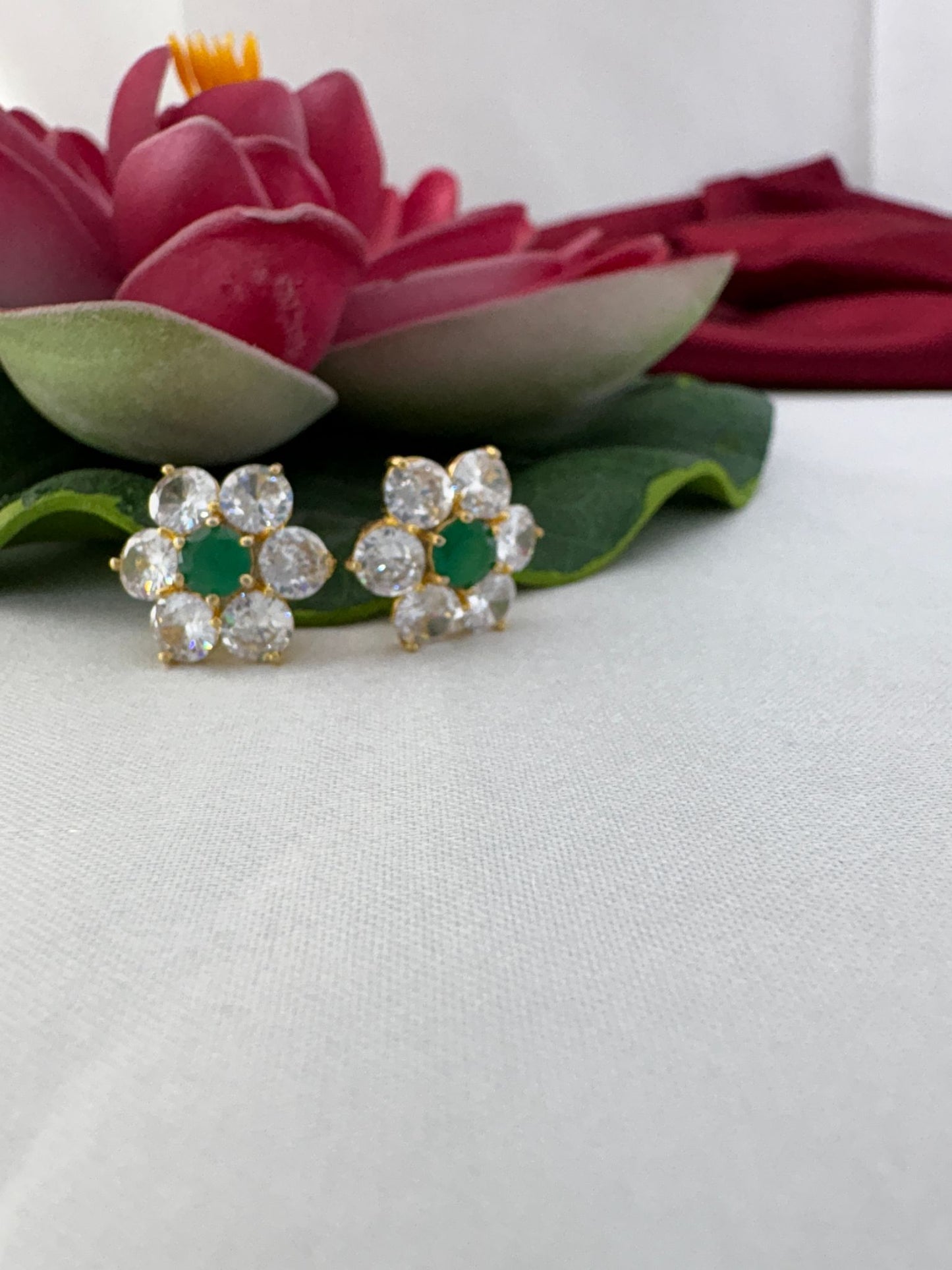 FeelOri white and green AD stud earrings styled with lotus creating timeless evergreen color palette appeal