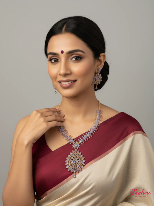 FeelOri Gold Plated Lavender Gemstone Peacock Motif Necklace Set - Model in traditional attire smiling warmly.
