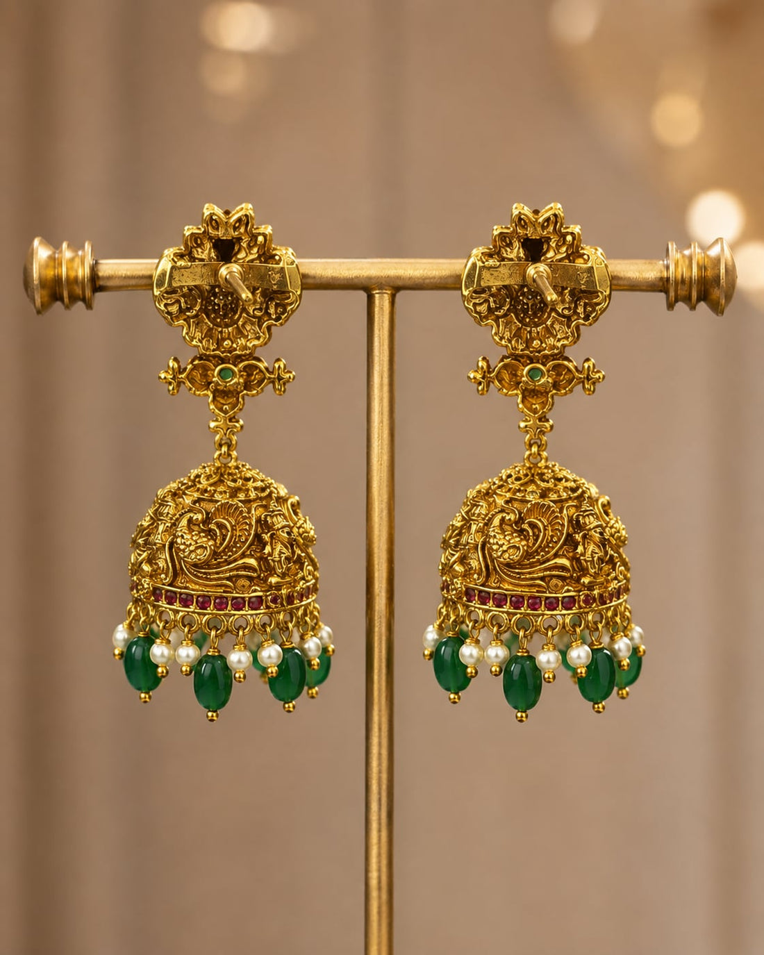 FeelOri gold-plated ruby and emerald jhumka earrings rear view showing openwork reverse, straight posts, and push-back closures