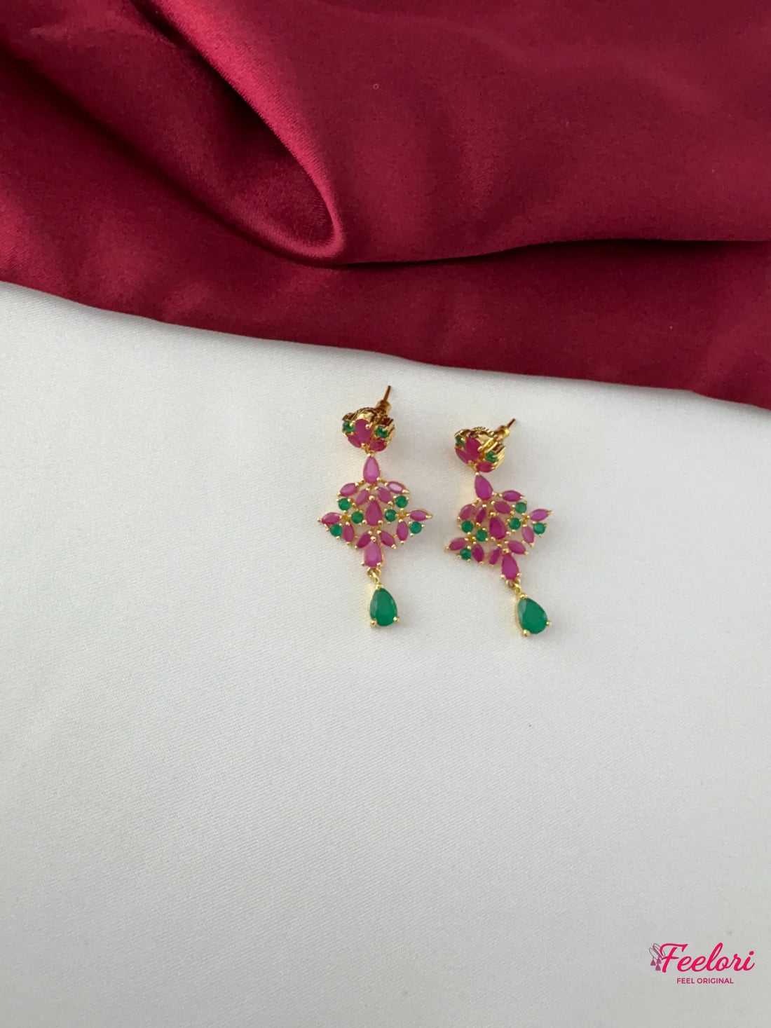 FeelOri Gold Plated Ruby Emerald Earrings - Close-up view highlighting the detailed floral cluster of Ruby CZ and emerald stones with a teardrop emerald accent.