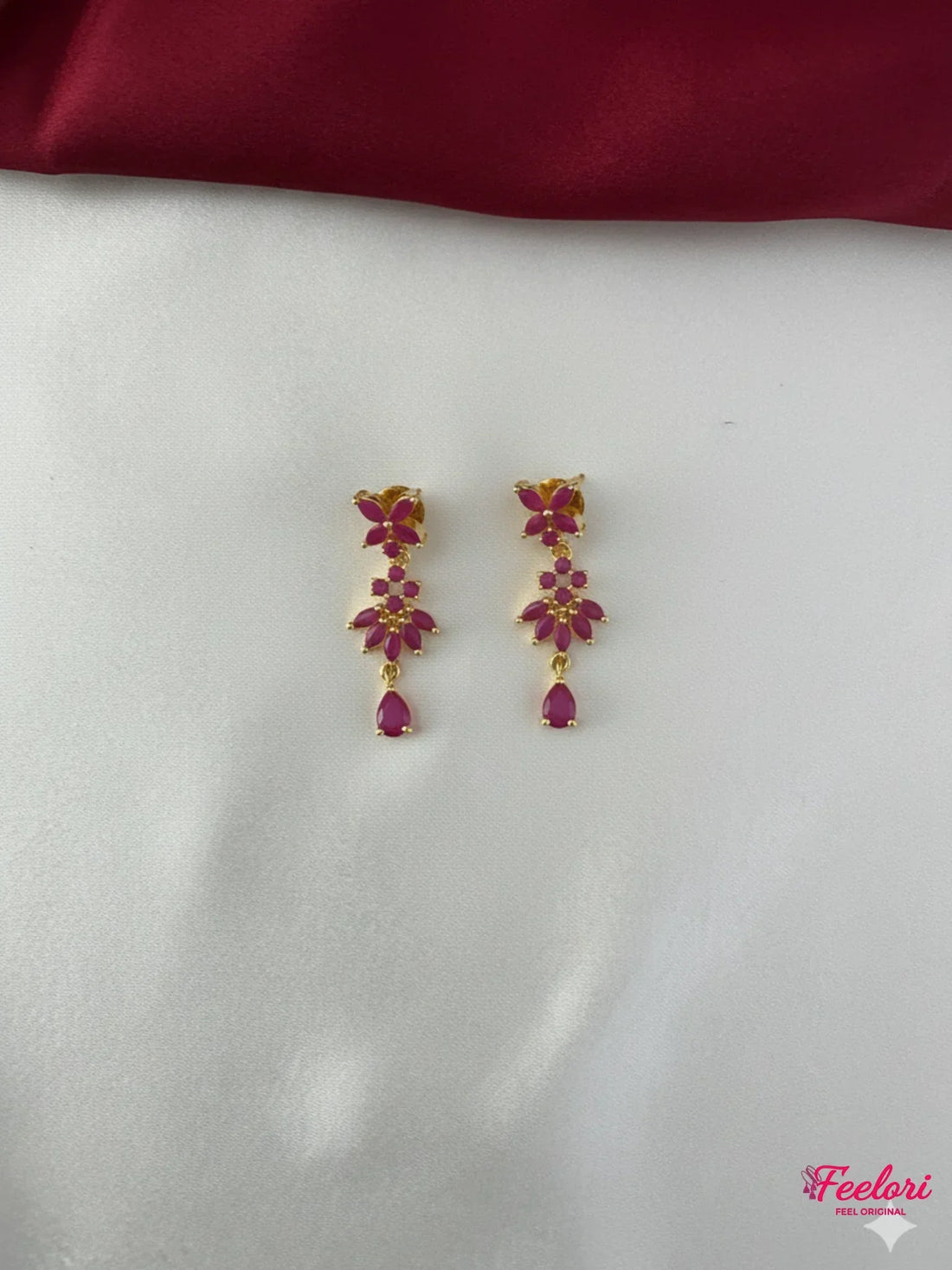 FeelOri Gold Plated Ruby Floral Earrings - Close-up view of the matching floral drop earrings with Ruby CZ-hued stones and push-back findings.