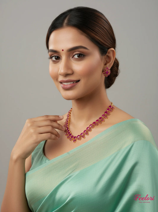 FeelOri Gold Plated Ruby Petal Necklace Set - Model wearing statement set with traditional saree.