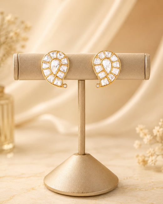 FeelOri gold-polished stud earrings on jewellery display