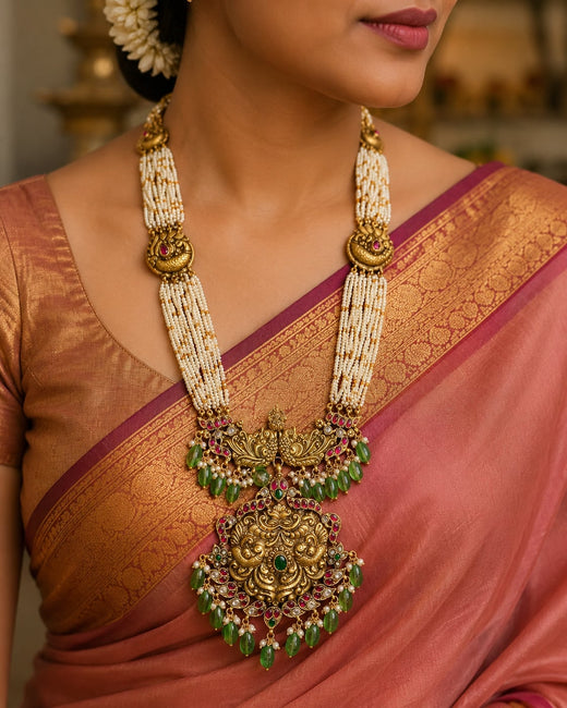 FeelOri lakshmi motif temple-style long haram necklace listed as long haram necklace on jewellery display