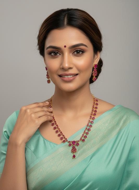 FeelOri Gold Plated Floral Ruby Necklace Earring Set - Model wearing dazzling set with light blue traditional saree.