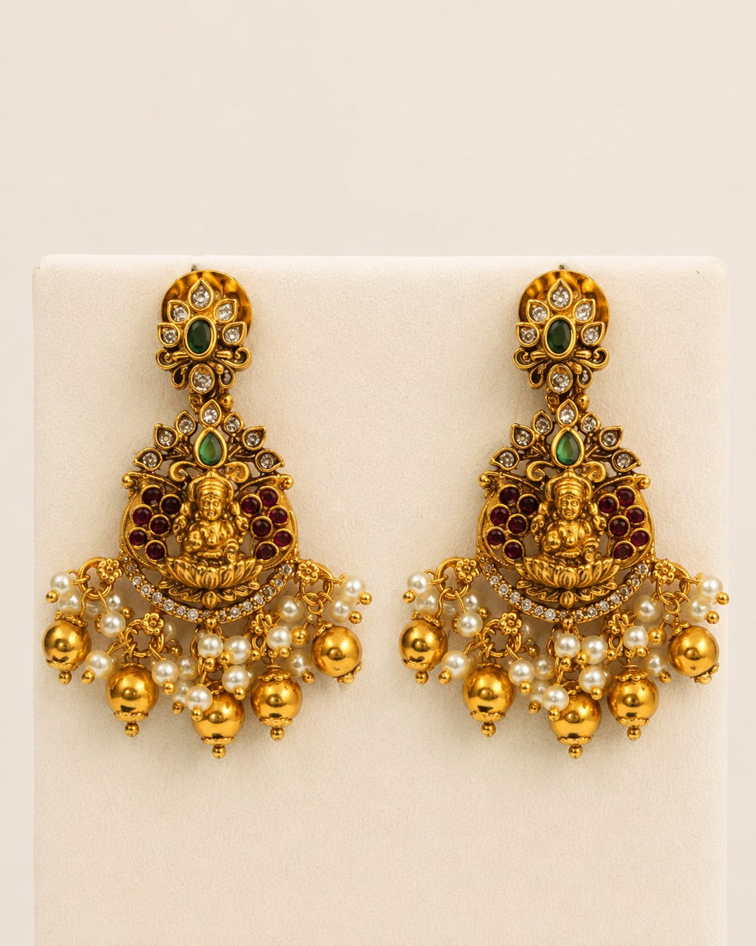 FeelOri ruby and emerald necklace set with matching earrings matching earrings only on a clean jewellery display
