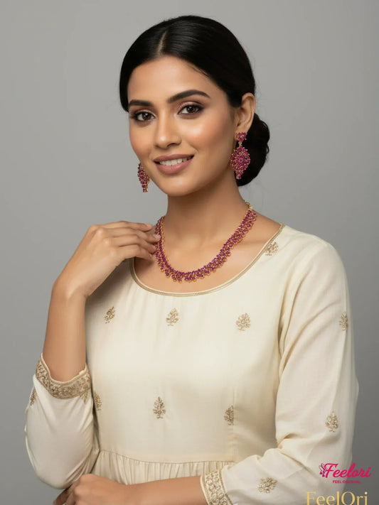 FeelOri Gold Plated Ruby Necklace Set - Model wearing elegant set with ivory kurti and embroidered details