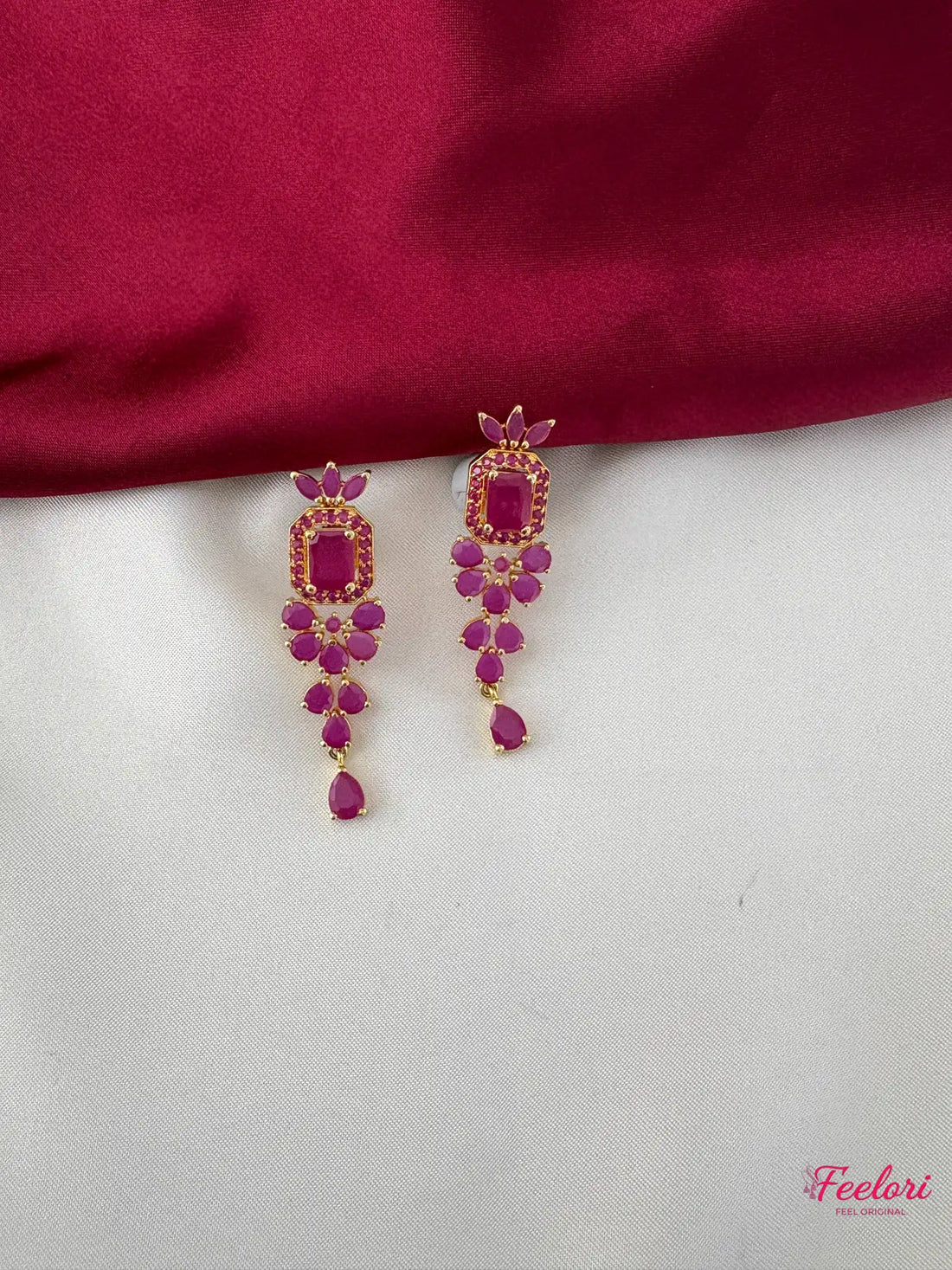 FeelOri Gold Plated Ruby Petal Earrings - Detailed view highlighting the intricate square centerpiece and dangling ruby-hued petals.