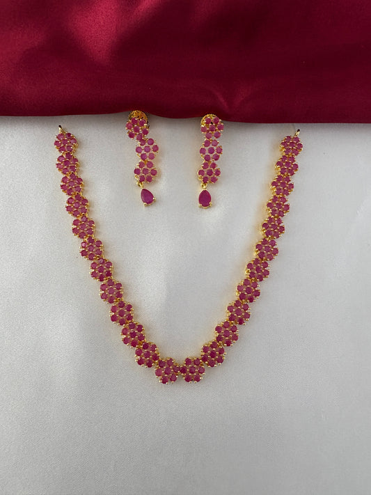 FeelOri Gold Plated Ruby Floral Strand Jewelry Set - Front view showcasing the complete necklace and matching earrings with delicate ruby flower clusters.