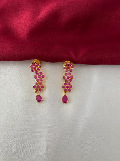 FeelOri Gold Plated Ruby Floral Strand Earrings - Detailed view of the matching earrings, highlighting the three ruby flower clusters and teardrop ruby accent.