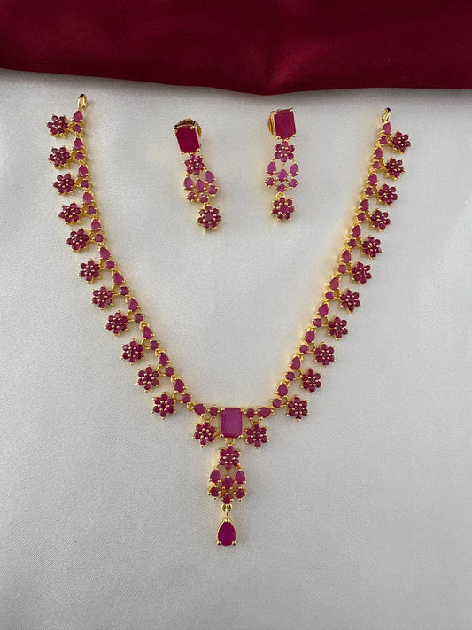 FeelOri Gold Plated Floral Ruby Necklace and Earring Set - Full view displaying the intricate leaf pattern and central rectangular pendant.