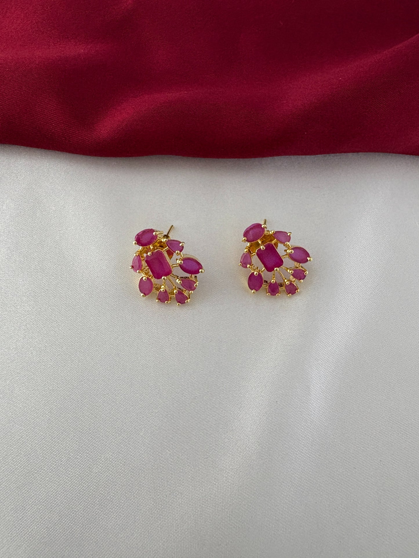 FeelOri Gold Plated Ruby Petal Earrings - Close-up view of the clustered ruby-hued stones set in a fan-like design, highlighting their intricate detail.