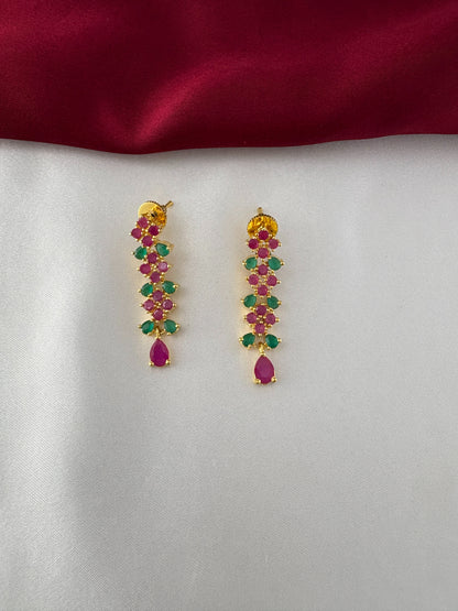 FeelOri Gold Plated Ruby Emerald Drop Earrings - Close-up view highlighting the detailed leaf arrangement and teardrop ruby-hued stone.