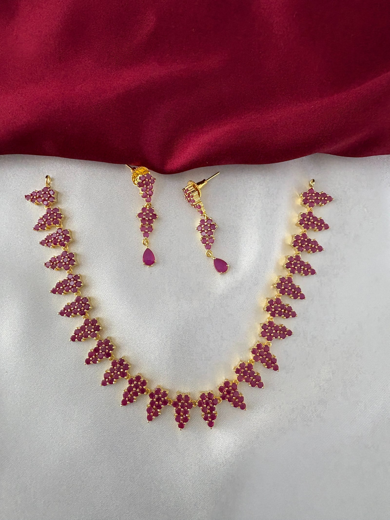 FeelOri Gold Plated Ruby Grapevine Cluster Necklace Set - Full ensemble showing the intricate arrangement of ruby clusters along the necklace and matching drop earrings.