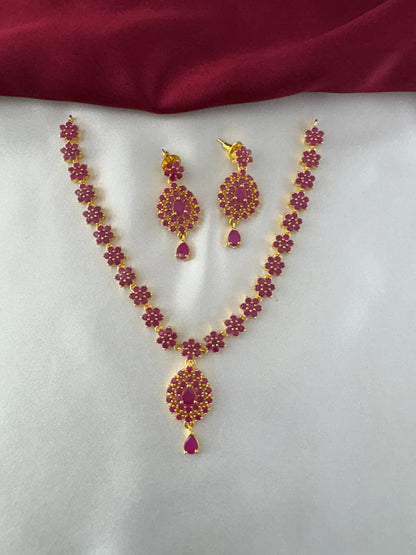 FeelOri Gold Plated Ruby Flower Strand Pendant Necklace Set - Full view showcasing the necklace with its individual floral units and matching earrings.