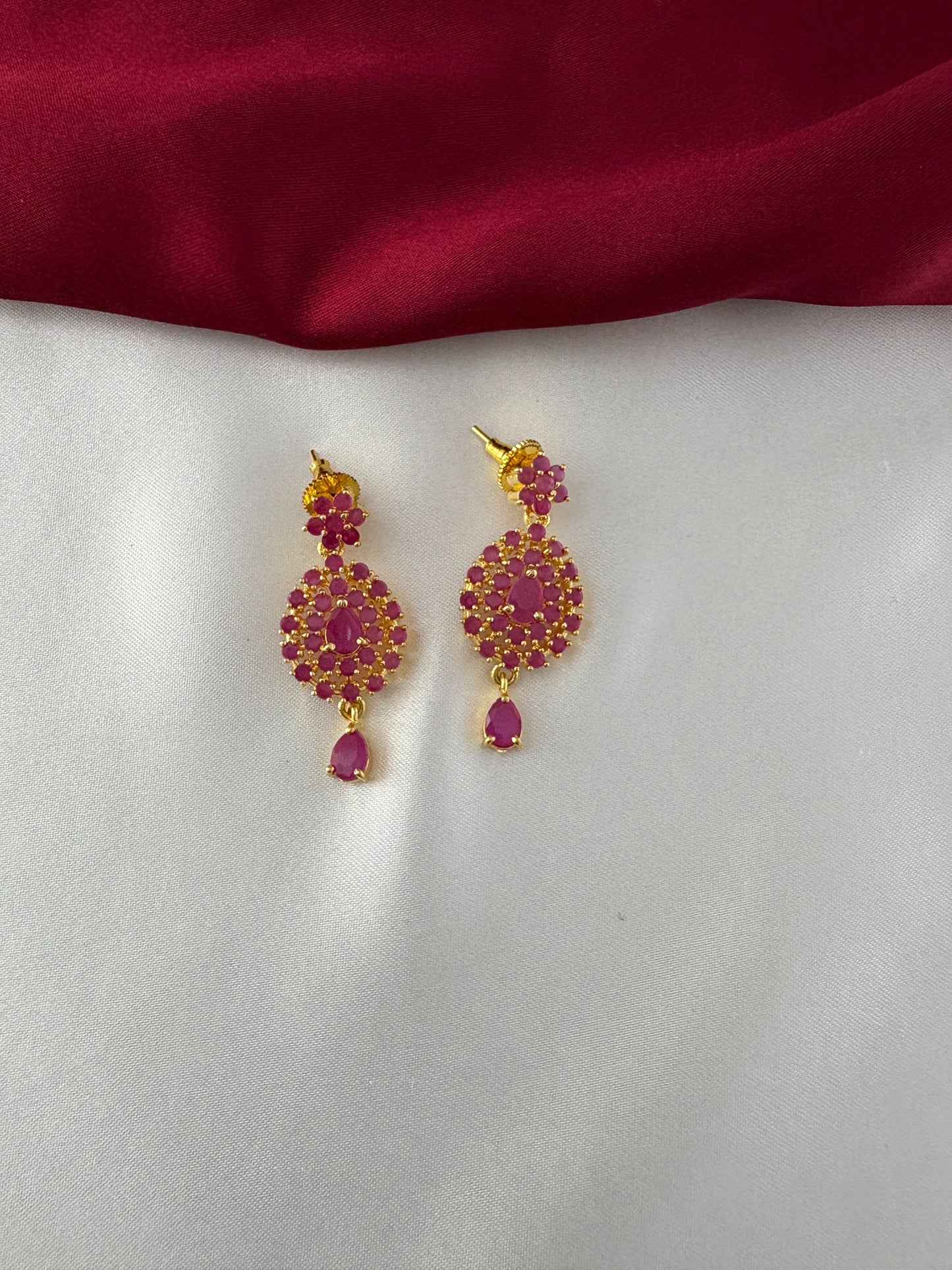 FeelOri Gold Plated Ruby Flower Earrings - Close-up view of the matching push-back earrings with their intricate ruby-hued floral cluster design and tear-drop dangle.