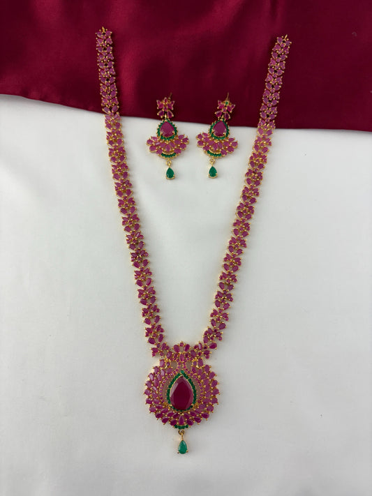 FeelOri Gold Plated Ruby Emerald Long Haram Necklace Set - Full front view showcasing the intricate floral pendant and matching drop earrings.