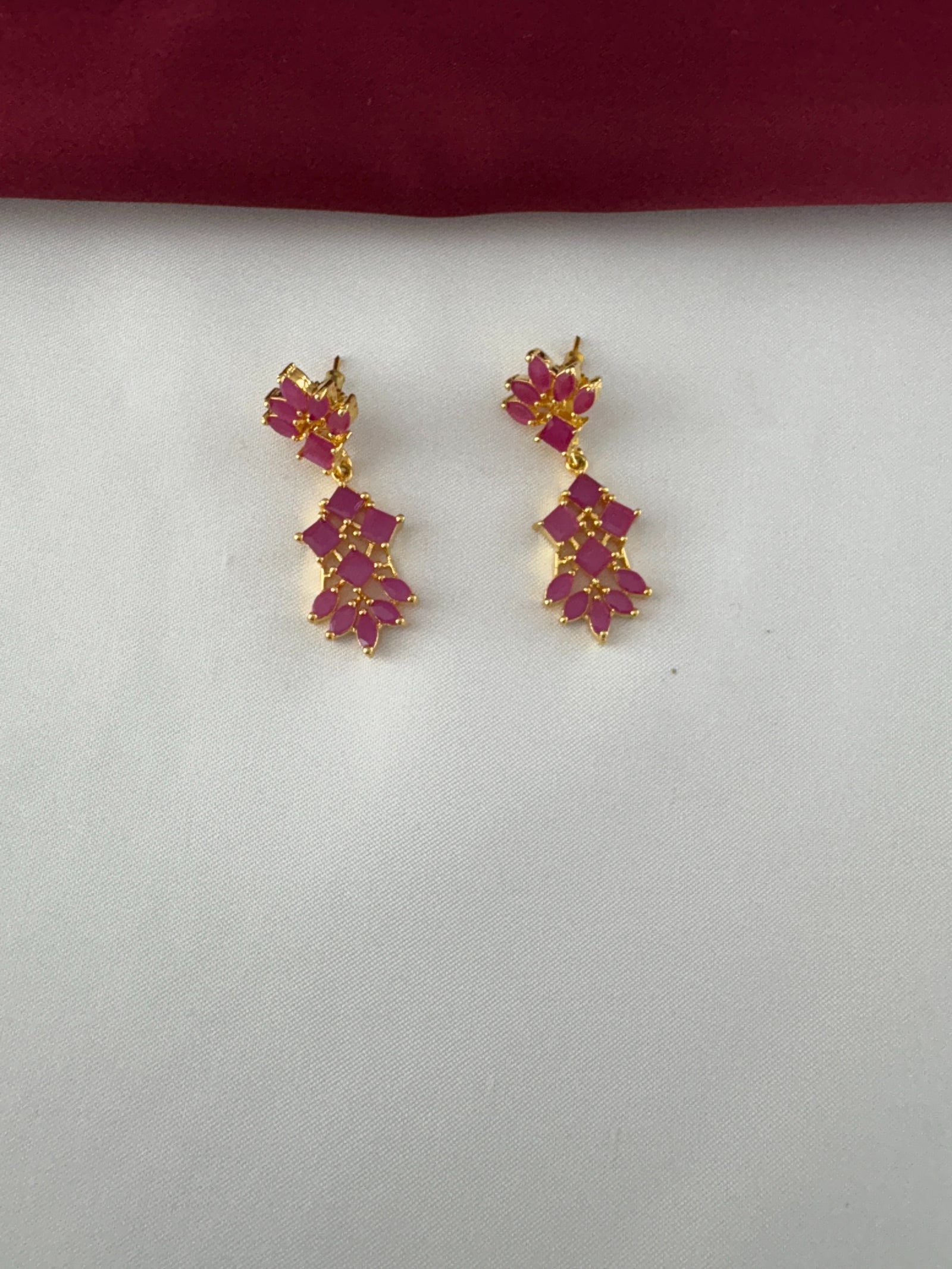 FeelOri Gold Plated Ruby Petal Cluster Earrings - Close-up view highlighting the intricate stone setting and golden detailing.