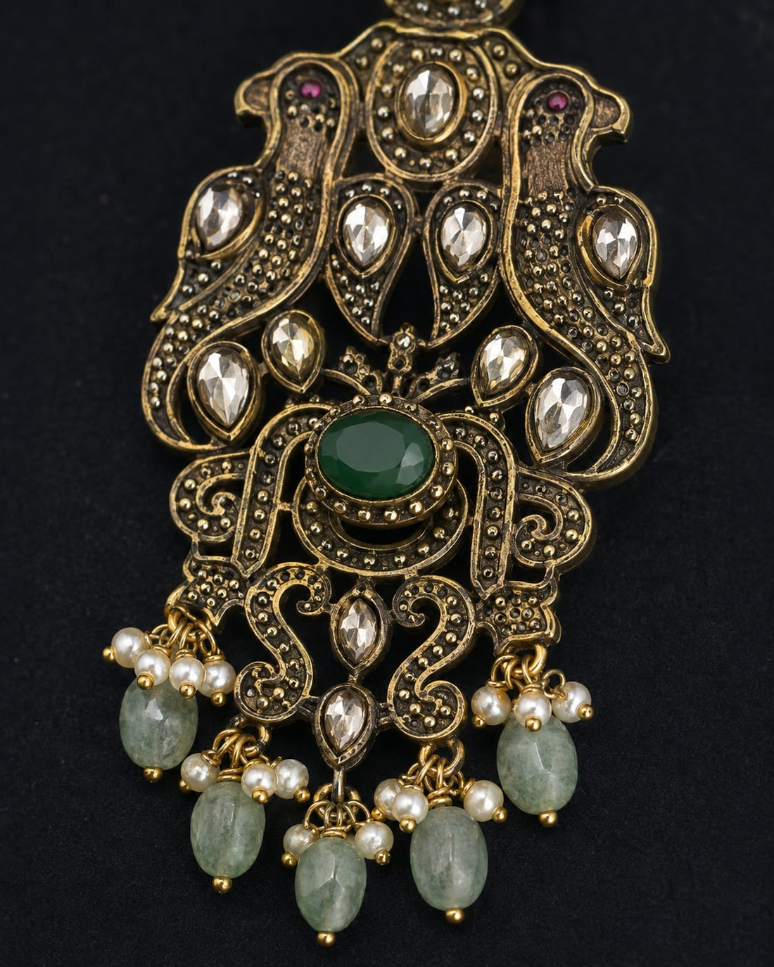 FeelOri emerald earrings stone setting, ear-chain or earring construction, and gold-polished finish detail