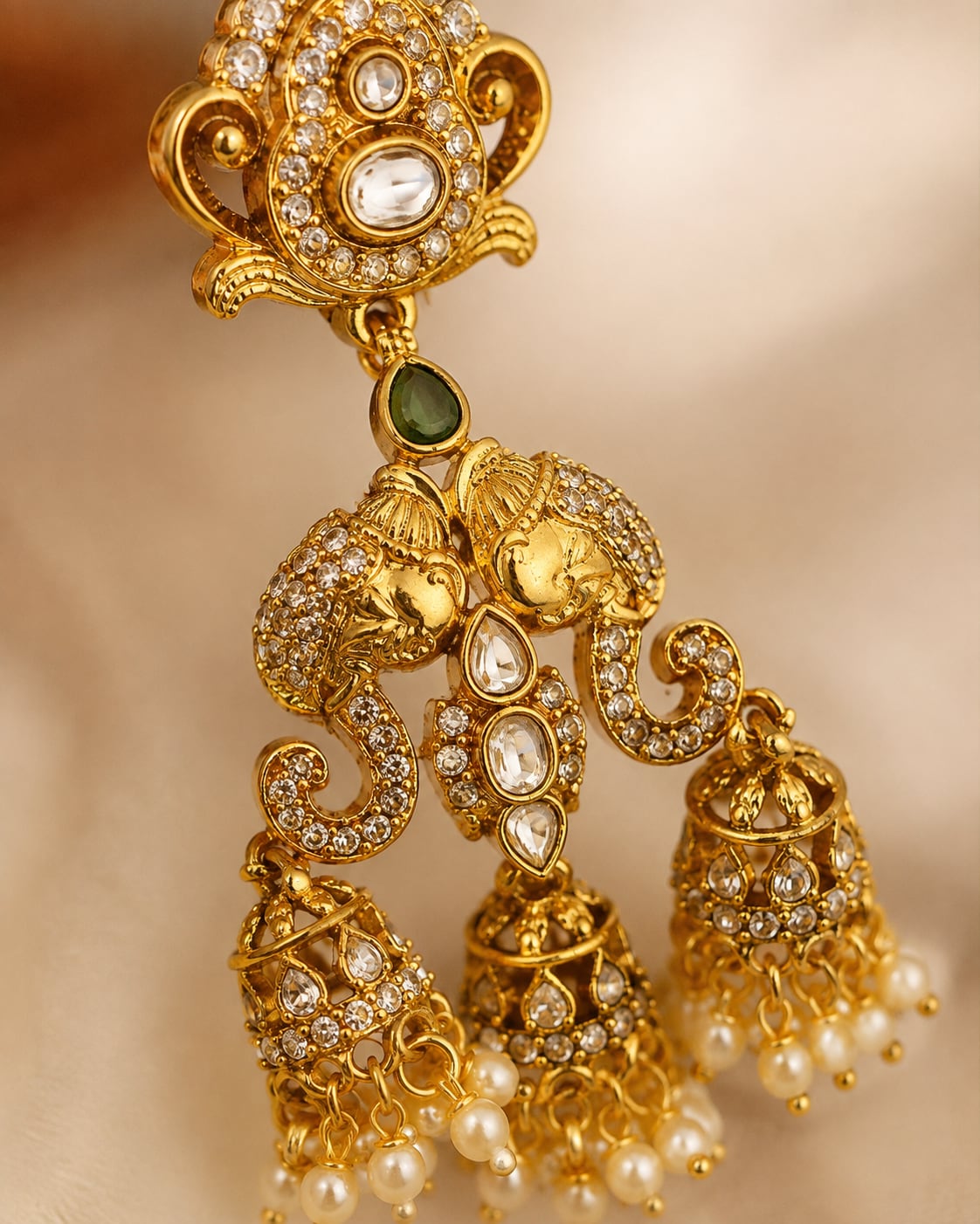 FeelOri emerald earrings stone setting, ear-chain or earring construction, and gold-polished finish detail