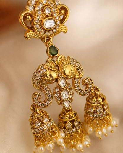 FeelOri emerald earrings stone setting, ear-chain or earring construction, and gold-polished finish detail