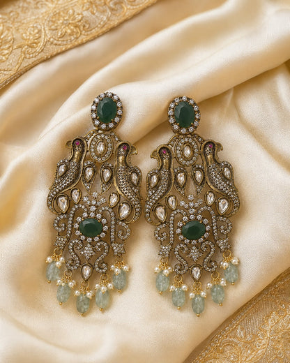 FeelOri emerald earrings styled with saree fabric for Indian occasion wear