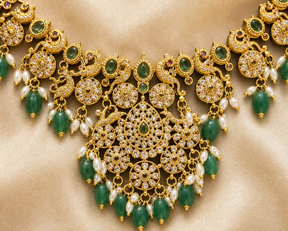 FeelOri emerald-tone necklace set with matching earrings pendant and gold-polished detail