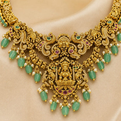 FeelOri emerald-tone necklace set with matching earrings pendant and gold-polished detail