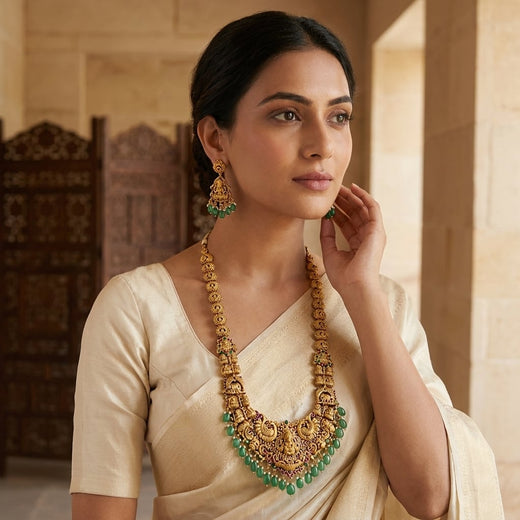 FeelOri Emerald Peacock Temple Necklace Set for Pattu Sarees with matching earrings, jewellery display view