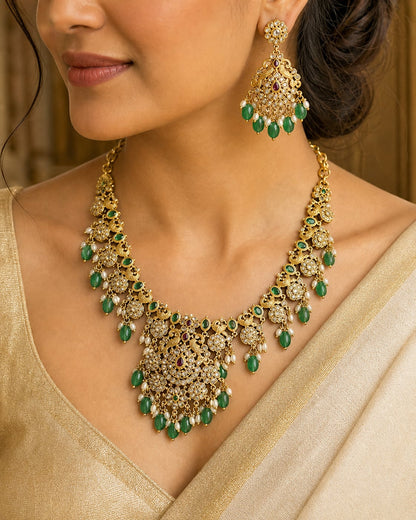 FeelOri emerald-tone necklace set with matching earrings styled with Indian occasion wear