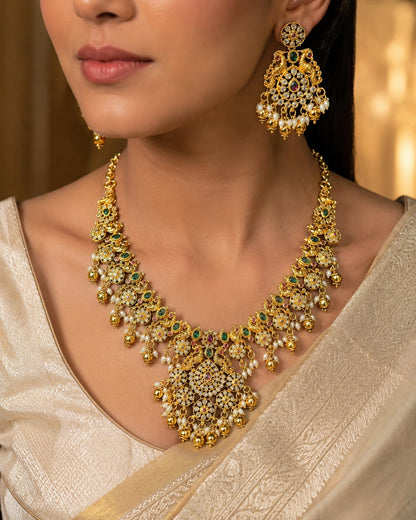 FeelOri emerald-tone necklace set with matching earrings styled with Indian occasion wear