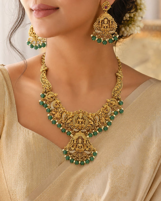 FeelOri Emerald Lakshmi Drop Necklace Set for Pattu Sarees with matching earrings, jewellery display view