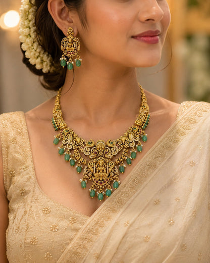 FeelOri emerald-tone necklace set with matching earrings styled with Indian occasion wear