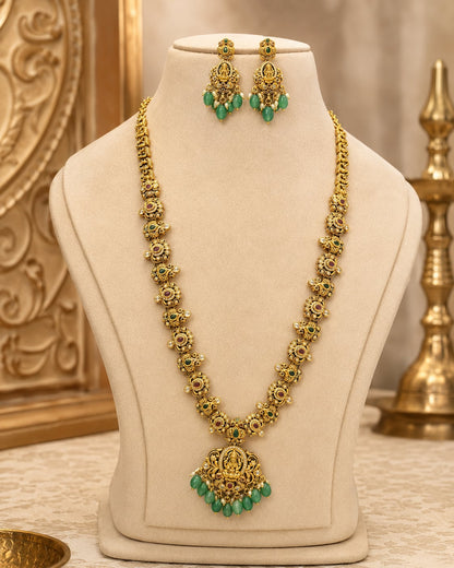 FeelOri emerald-tone necklace set with matching earrings styled with Indian occasion wear