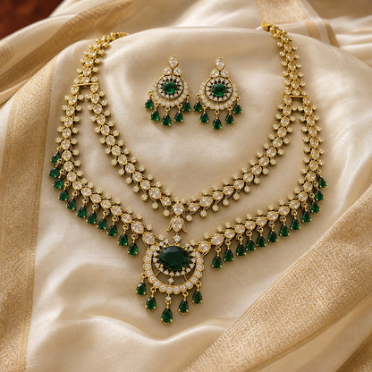 FeelOri emerald-tone necklace set with matching earrings styled with saree fabric for Indian occasion wear