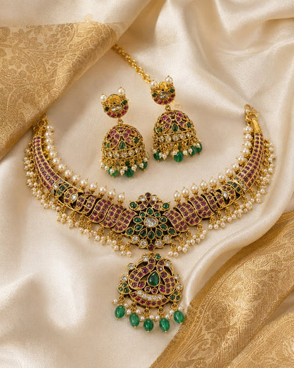 FeelOri emerald-tone necklace set with matching earrings styled with saree fabric for Indian occasion wear