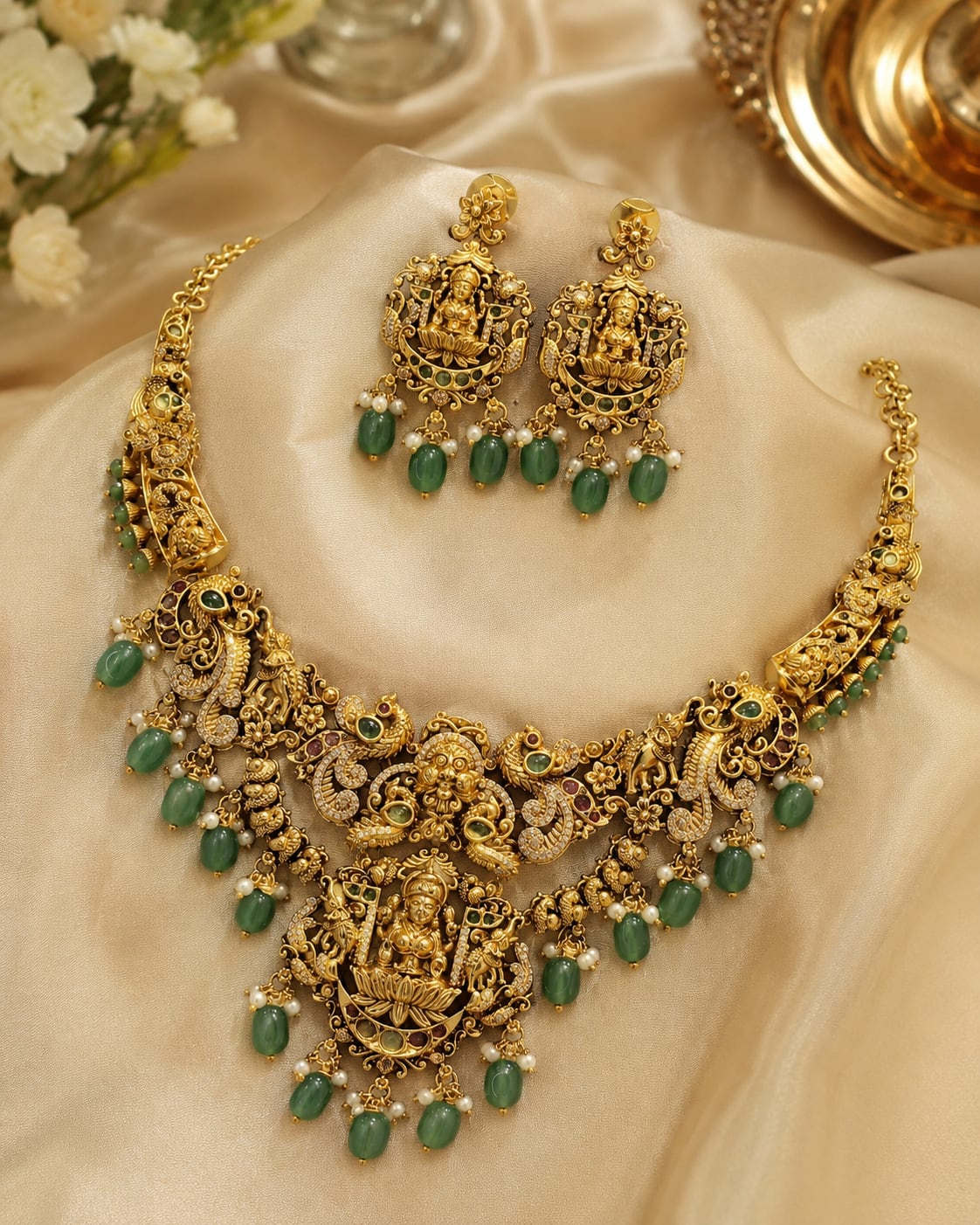 FeelOri emerald-tone necklace set with matching earrings styled with saree fabric for Indian occasion wear