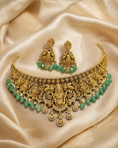 FeelOri emerald-tone necklace set with matching earrings styled with saree fabric for Indian occasion wear