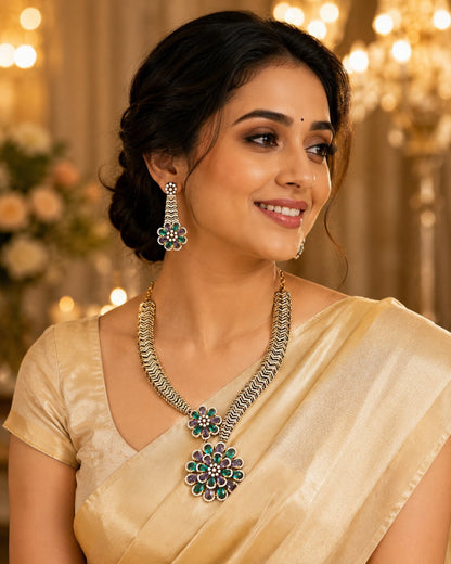 FeelOri emerald-tone necklace set with matching earrings styled with saree fabric for Indian occasion wear