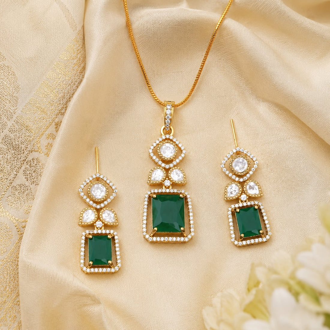 FeelOri emerald-tone pendant set styled with saree fabric for Indian occasion wear