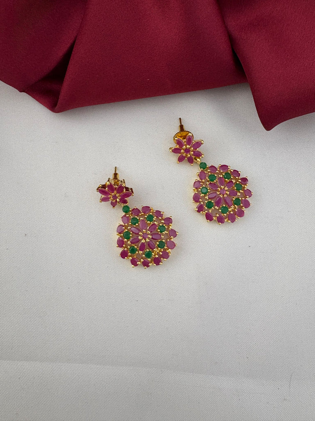 FeelOri Andhra Festive Gem Ruby & Emerald Short Necklace Set - Detailed close-up of the matching earrings showcasing ruby and emerald stones.
