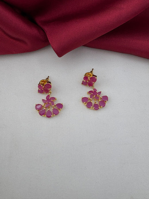 Close-up of FeelOri Antique Finish Ruby-Tone CZ earrings, part of the short necklace set. Detailed view of the ruby floral design on the earrings.
