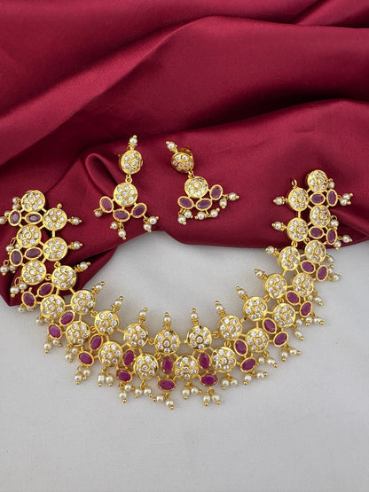 FeelOri Aurora Ruby & AD Halo Bridal Set - front view of gold necklace and earrings with red and clear stones, perfect for Hyderabad weddings.