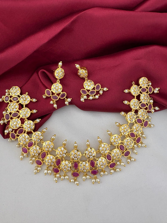 FeelOri Aurora Ruby & AD Halo Bridal Set - front view of gold necklace and earrings with red and clear stones, perfect for Hyderabad weddings.