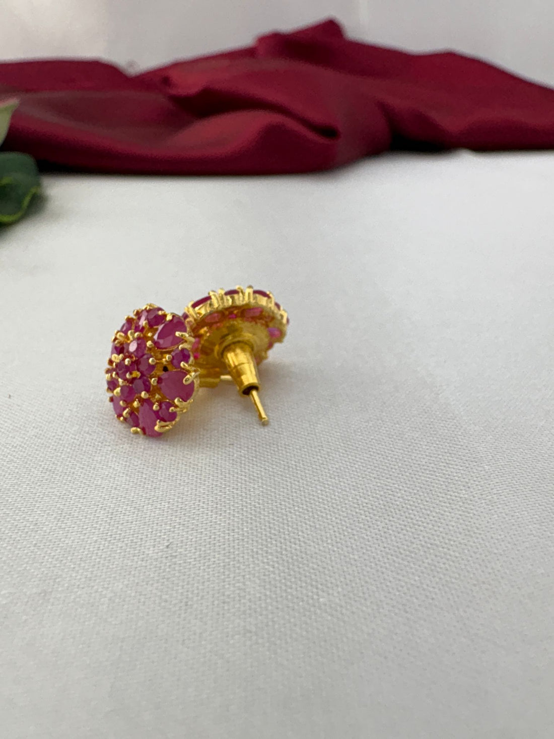 FeelOri Berry Sorbet medium cool pink AD stud earrings angled view displaying gold post and secure back mechanism