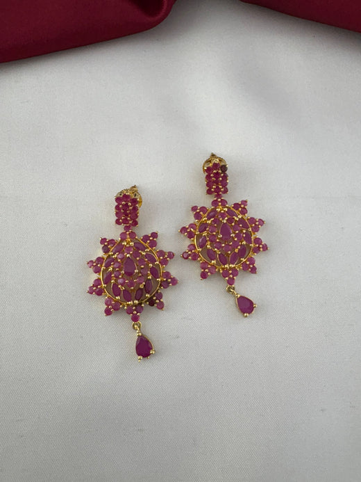 Close-up of FeelOri Bold Statement Ruby-Tone CZ Earrings showcasing intricate stone details and design.