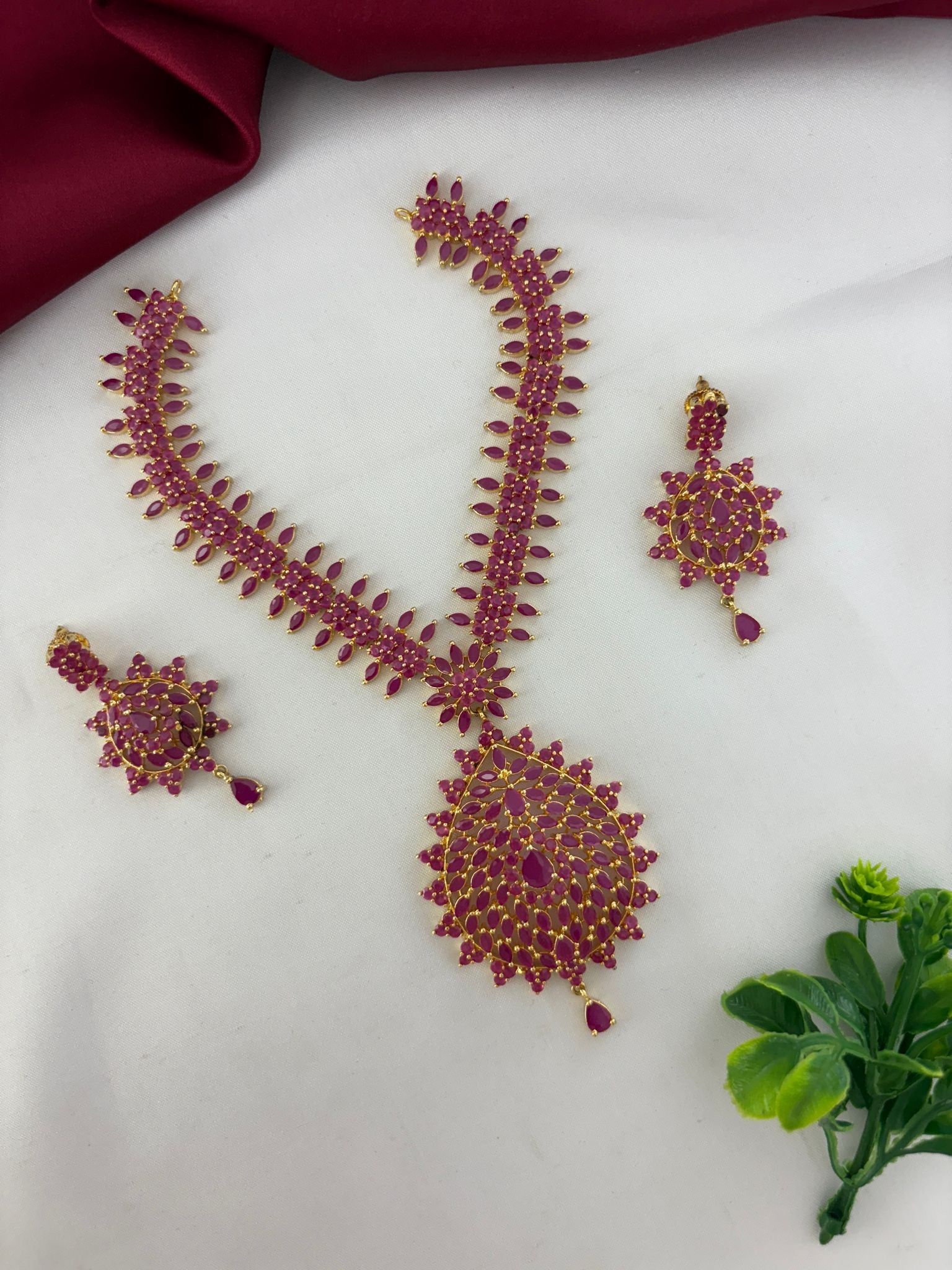 FeelOri Bold Statement Original Ruby Short Necklace Set presented from an angled perspective to show dimension.